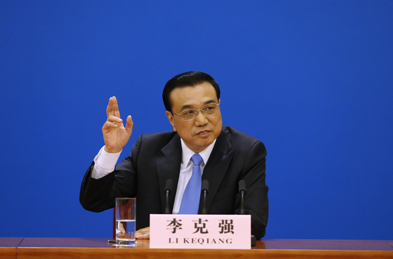 3月15日，國務(wù)院總理李克強在北京人民大會堂與中外記者見面，并回答記者提問。 新華社記者 沈伯韓 攝